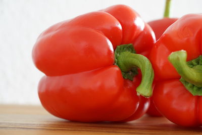 Close-up of red bell peppers on table