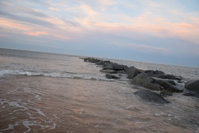 Scenic view of sea against sky at sunset