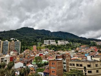 View of town against cloudy sky