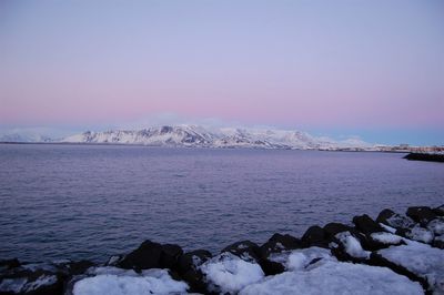 Scenic view of sea against sky during winter