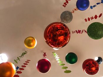 Low angle view of multi colored baubles