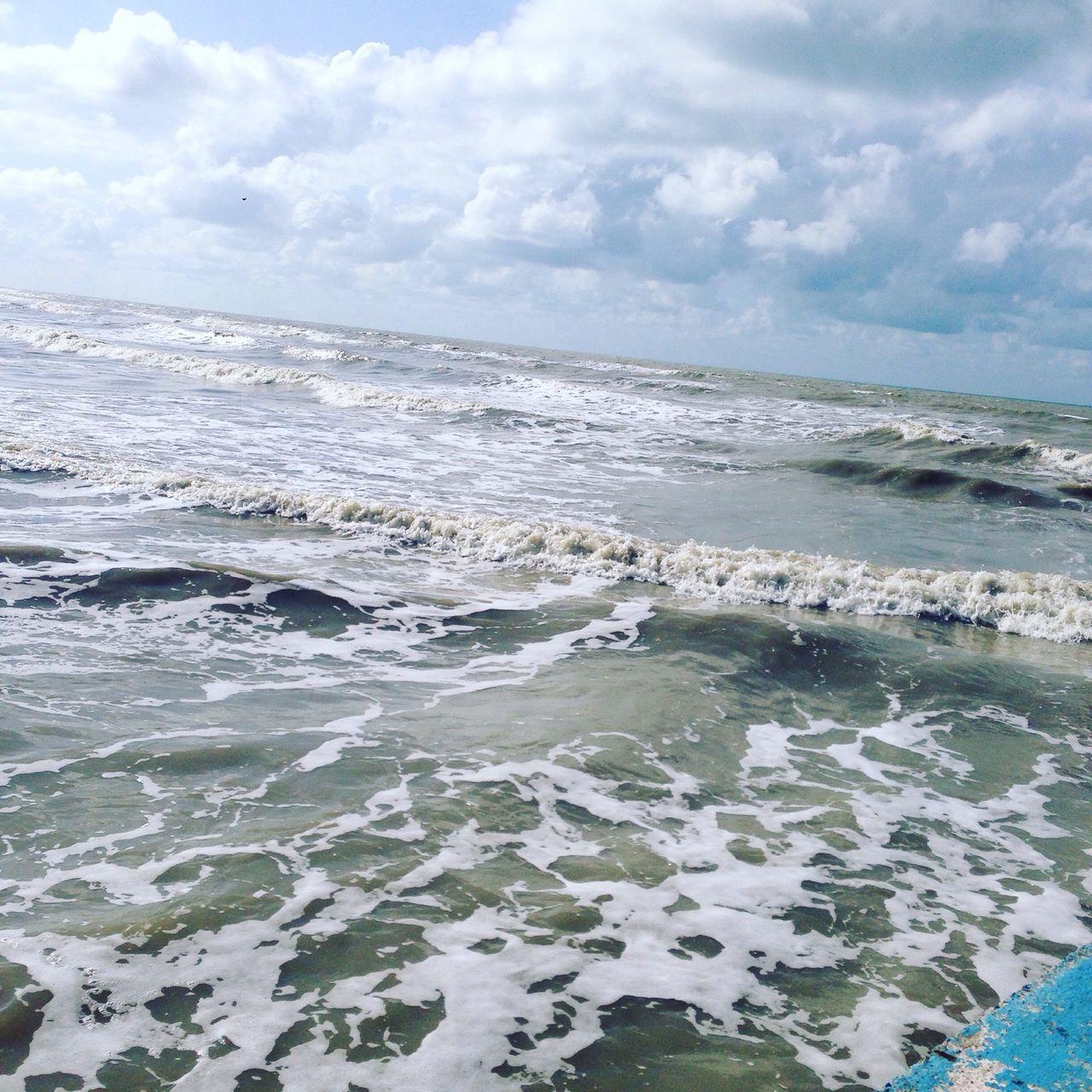 sea, water, sky, horizon over water, beach, cloud - sky, scenics, wave, beauty in nature, tranquil scene, cloudy, tranquility, surf, nature, shore, cloud, idyllic, seascape, sand, day