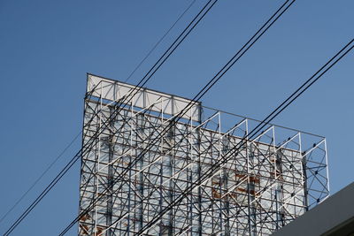 Low angle view of building against clear blue sky