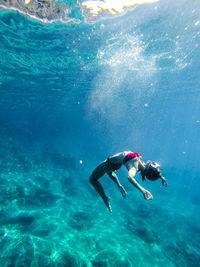 Woman swimming in sea