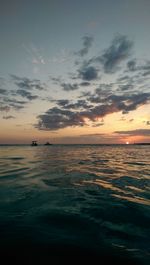 Scenic view of sea at sunset