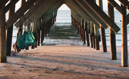 Wooden posts on beach