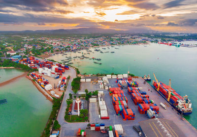 High angle view of commercial dock against sky during sunset