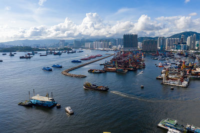 High angle view of sailboats at harbor in city