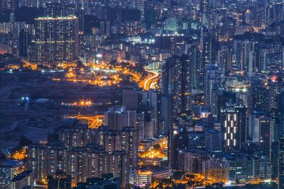 Aerial view of city lit up at night