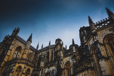 Low angle view of church against blue sky