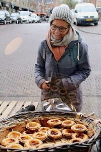 Rear view of man preparing food