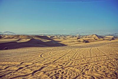 Scenic view of desert against clear sky