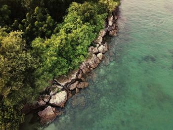 High angle view of rocks by sea