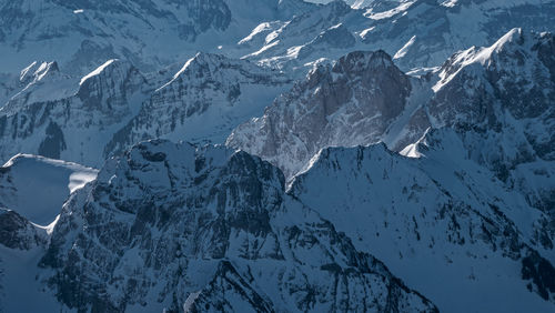 Full frame shot of snowcapped mountains during winter