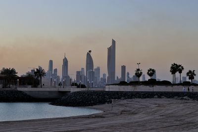 View of modern buildings against sky during sunset