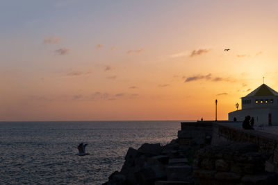 Scenic view of sea against sky during sunset