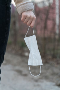 Close-up of hand holding umbrella