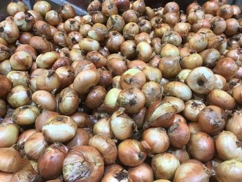 Full frame shot of onions for sale at market stall