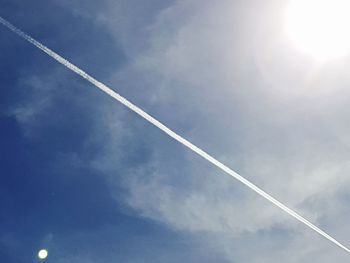 Low angle view of vapor trails in sky