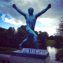 Low angle view of statue against cloudy sky