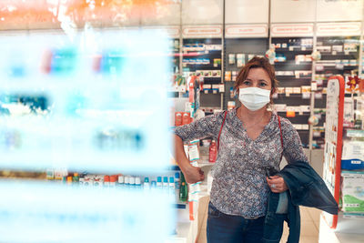 Portrait of woman standing in store