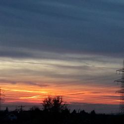 Scenic view of dramatic sky at sunset