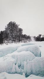 Scenic view of frozen lake against clear sky