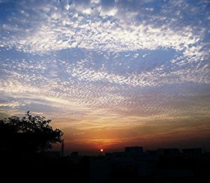 Scenic view of landscape against sky at sunset