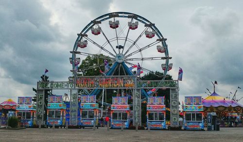 Low angle view of ferris wheel against sky