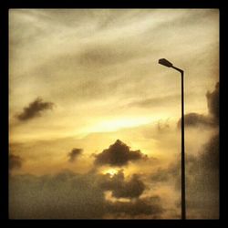 Low angle view of cloudy sky at sunset