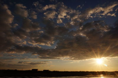 Sun shining through clouds