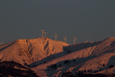 Scenic view of snowcapped mountains against clear sky