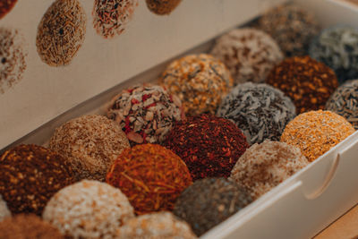 Assorted handmade truffle chocolates candies made from organic ingredients. raw food diet concept.