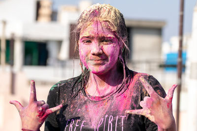 Young girl celebrating holi festival