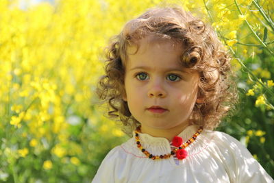 Portrait of cute girl with curly hair