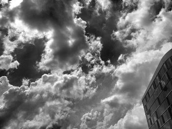 Low angle view of building against cloudy sky