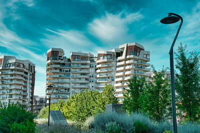 Low angle view of buildings against blue sky