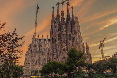 Low angle view of sagrada famila during sunset