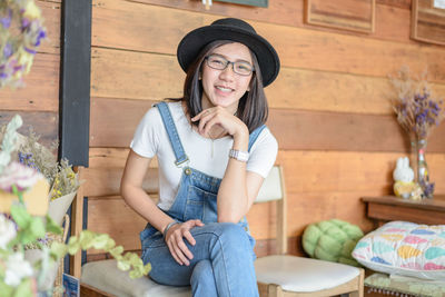 Woman sitting on chair in cafe