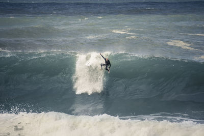 People surfing in sea