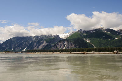 Scenic view of lake and mountains against sky