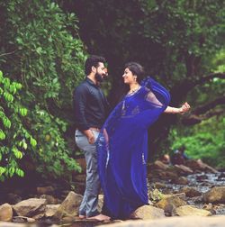 Young couple standing in forest