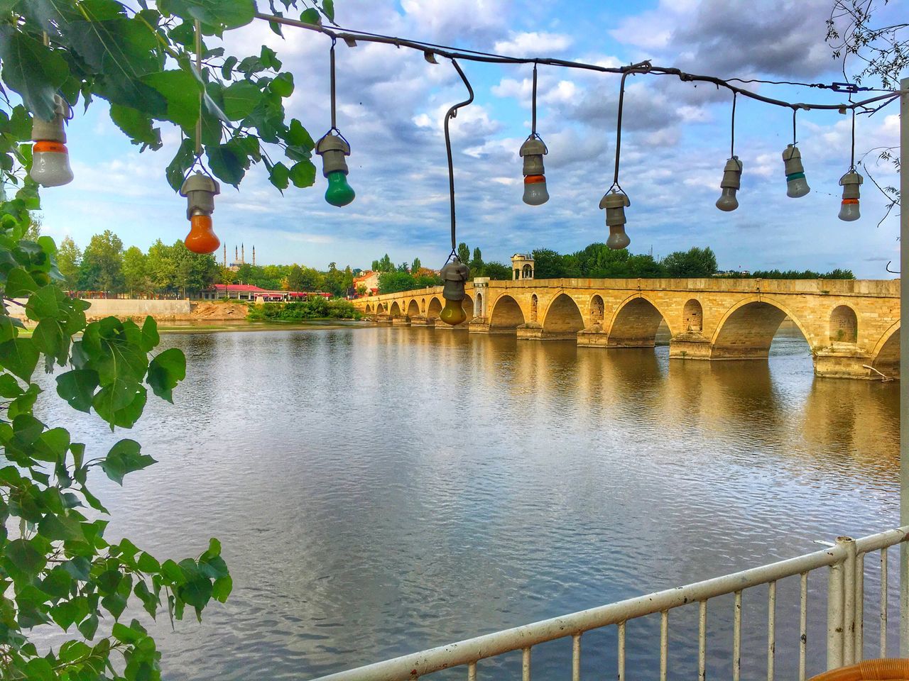 arch, bridge - man made structure, connection, architecture, tree, built structure, water, day, outdoors, transportation, nature, growth, no people, sky, beauty in nature