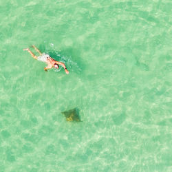 High angle view of people swimming in pool