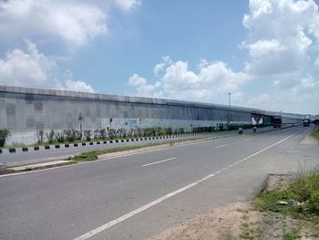 Road against cloudy sky