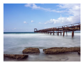 View of bridge over sea against sky