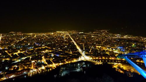 Aerial view of illuminated city at night