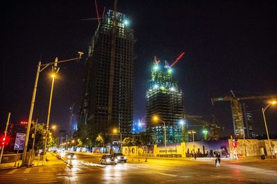 Ferris wheel in city at night