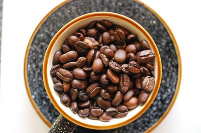 High angle view of coffee beans in bowl