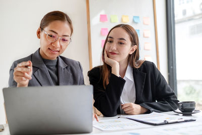Business colleagues working at office